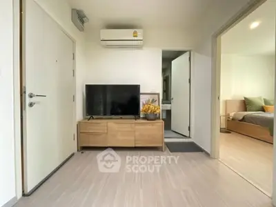 Modern living room with TV and air conditioning in a stylish apartment
