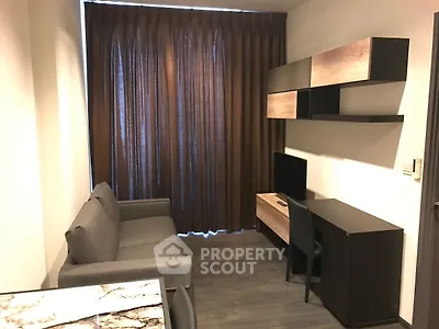 Modern living room with sleek furniture and dark curtains, perfect for urban living.