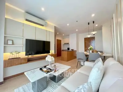 Modern living room with elegant decor and open dining area