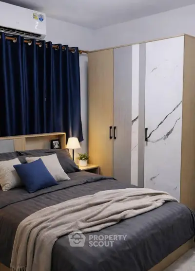 Cozy bedroom with modern wardrobe and elegant decor