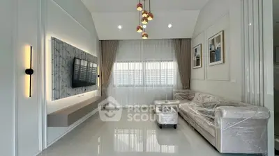 Modern living room with sleek design, elegant lighting, and stylish furniture.