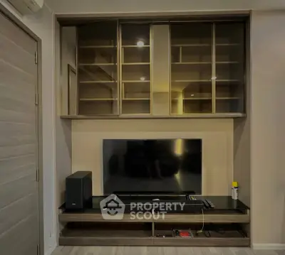 Modern living room with sleek entertainment center and built-in shelving