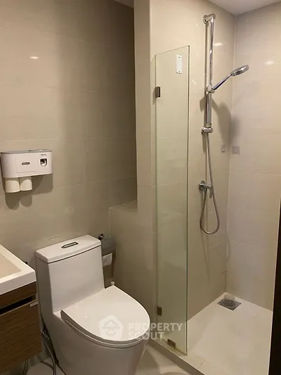 Modern bathroom with sleek shower and toilet design