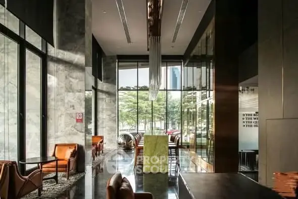 Luxurious modern lobby with elegant seating and floor-to-ceiling windows.