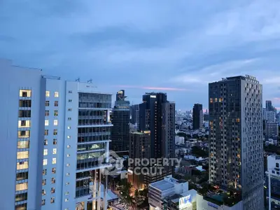 Stunning cityscape view with modern high-rise buildings at dusk.