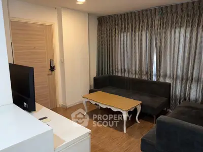 Cozy living room with elegant curtains and stylish furniture in modern apartment.