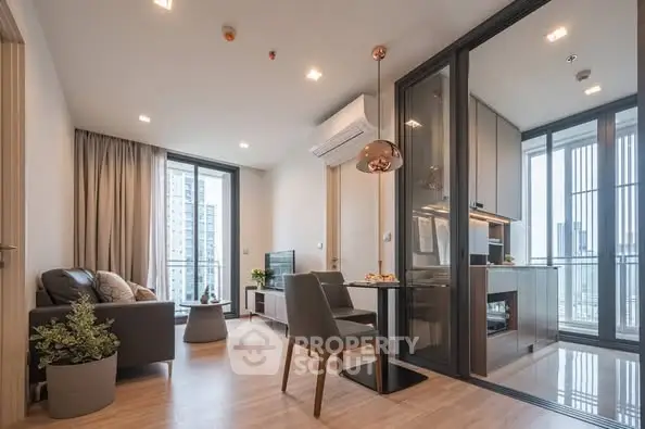 Modern open-plan living room with glass partition and city view