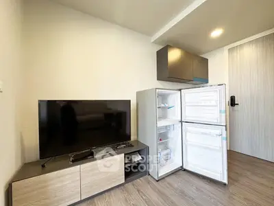 Modern living room with TV and open fridge in stylish apartment