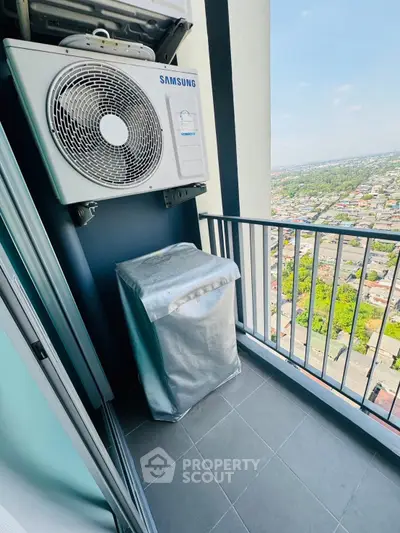 High-rise balcony with air conditioning unit and city view