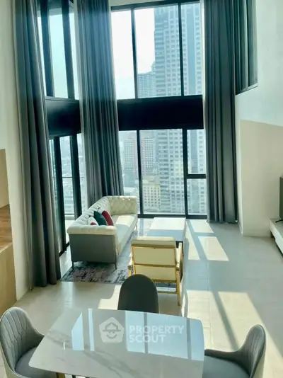 Luxurious high-rise living room with floor-to-ceiling windows and stunning city view.