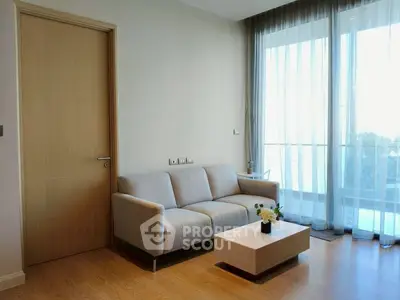 Modern living room with cozy sofa and large window view