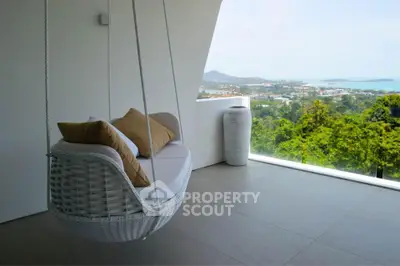 Luxurious balcony with stunning panoramic view and stylish hanging chair