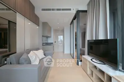 Modern living room with sleek design and open kitchen layout