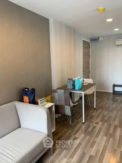 Modern living room with stylish furniture and wooden flooring