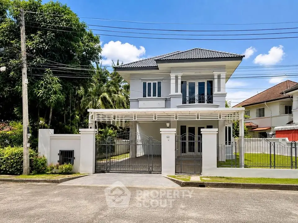 Stunning two-story house with modern design and spacious driveway in a serene neighborhood.