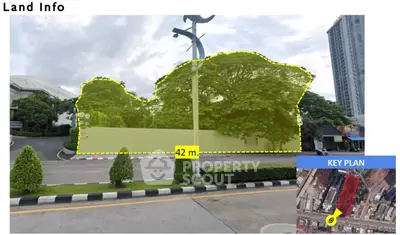 Prime land plot with lush greenery and urban surroundings, ideal for development opportunities.