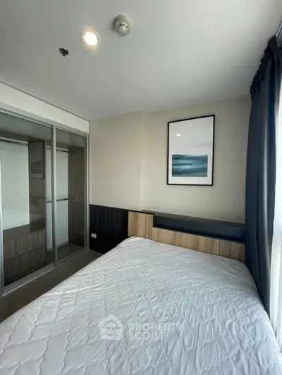 Modern bedroom with large window and stylish decor in urban apartment