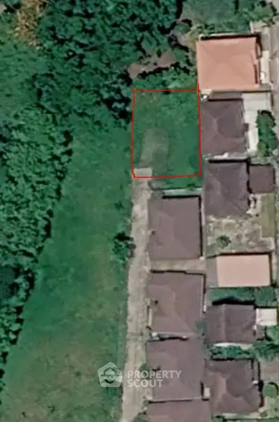 Aerial view of residential area with lush greenery and houses in a serene neighborhood.