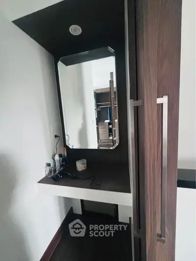 Modern bedroom with stylish vanity and ample storage space