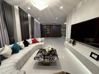 Luxurious modern living room with elegant decor and spacious seating area.