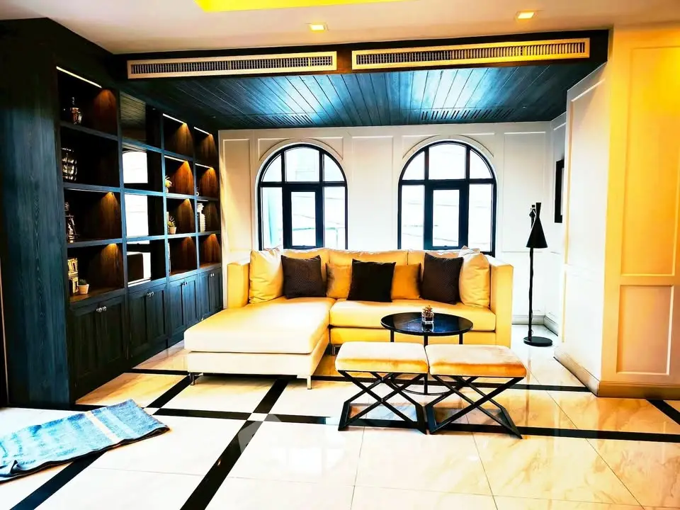 Luxurious living room with elegant decor and large windows