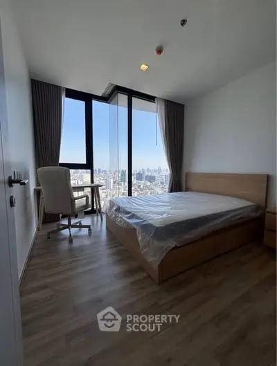 Modern bedroom with city view and stylish furnishings