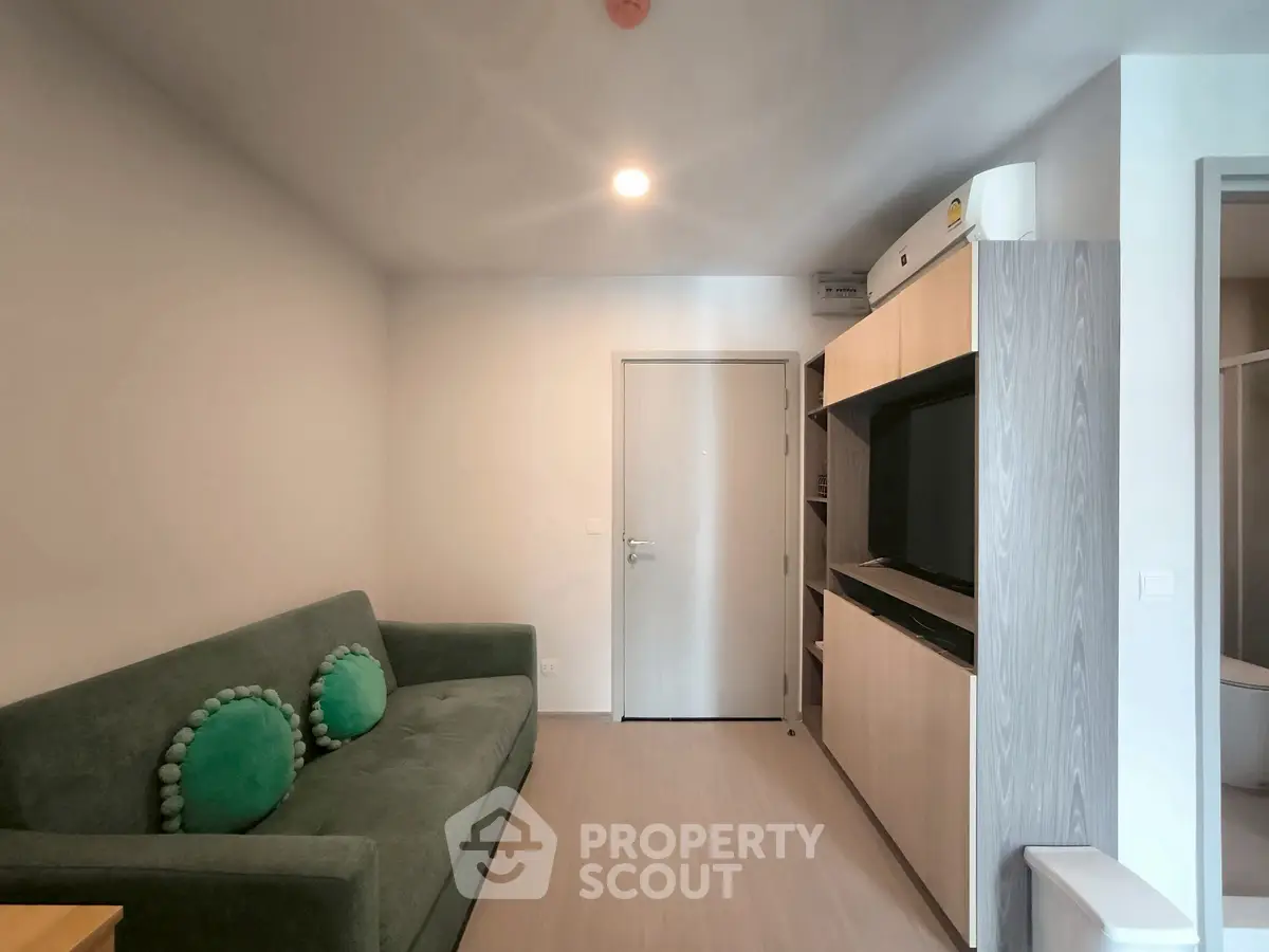 Modern living room with sleek furniture and minimalist design, perfect for urban living.