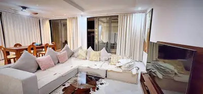 Spacious modern living room with elegant decor and large sectional sofa