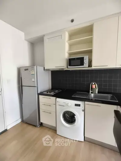 Modern kitchen with sleek appliances and efficient layout