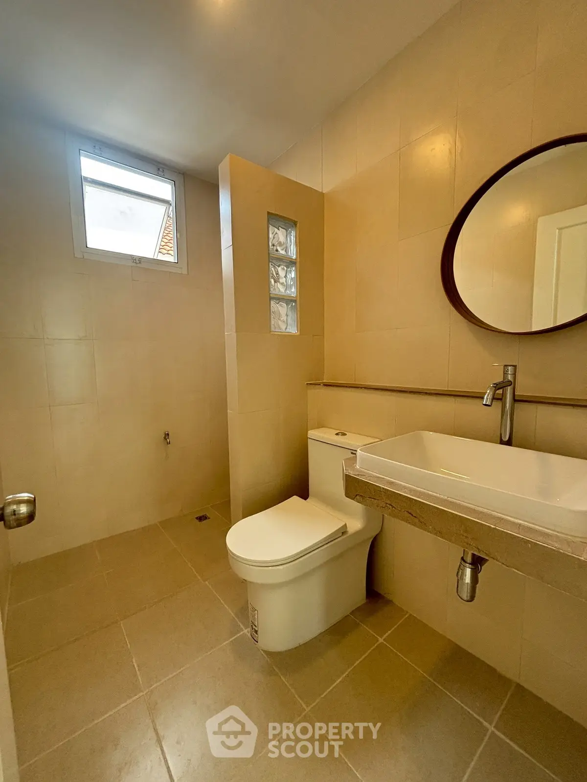 Modern bathroom with sleek fixtures and neutral tile design