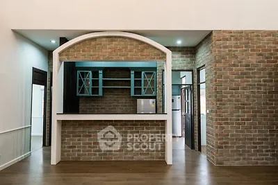 Charming brick interior with open kitchen layout and modern appliances