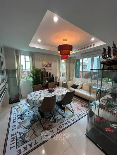 Stylish living room with modern decor, cozy seating, and elegant lighting in a bright, airy space.