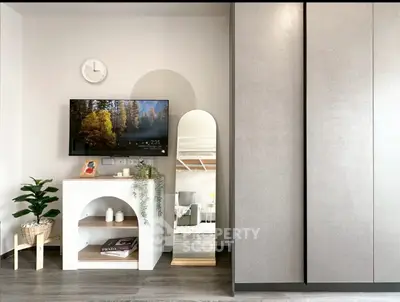 Modern living room with stylish decor and wall-mounted TV