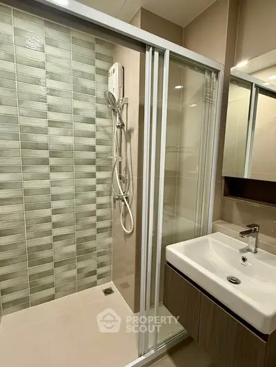 Modern bathroom with glass shower and sleek sink design