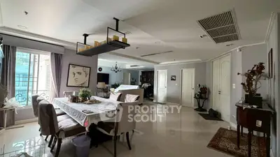 Elegant dining area in spacious open-plan living room with modern decor