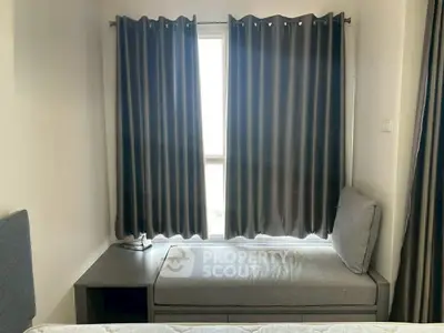 Cozy bedroom nook with window seat and modern curtains