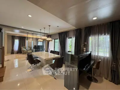 Luxurious open-plan living room with elegant dining area and modern decor