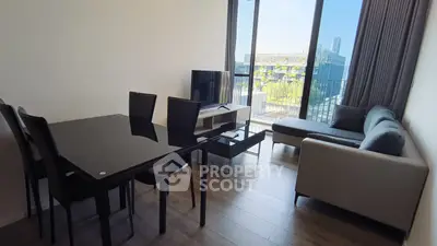 Modern living room with sleek furniture and balcony view in urban apartment
