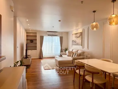 Spacious and elegant living room with modern decor and natural light