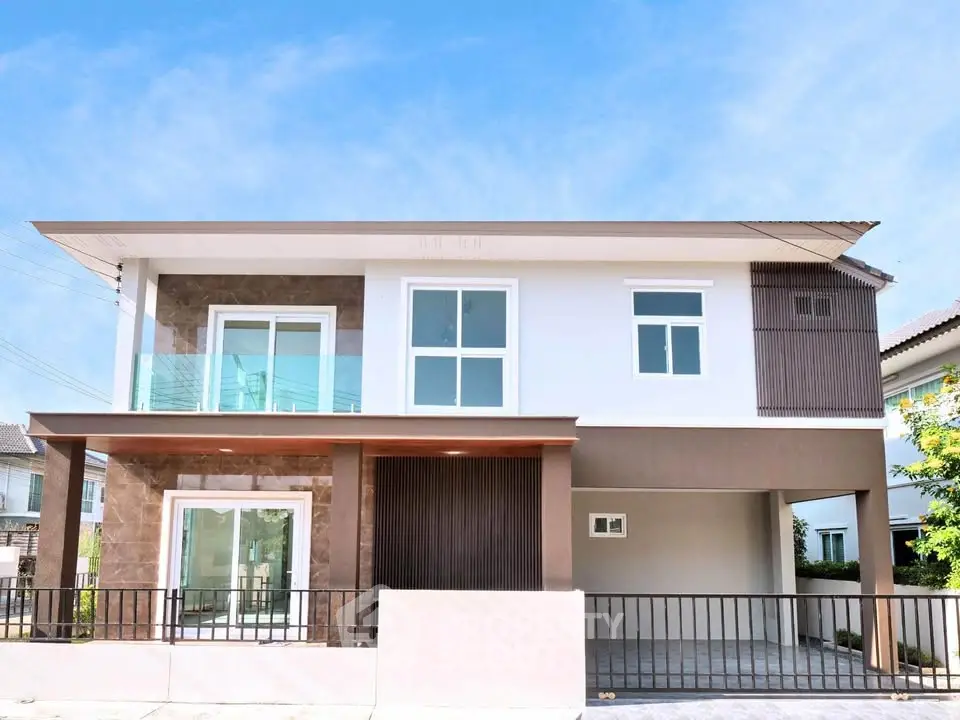 Modern two-story house with sleek design and large windows