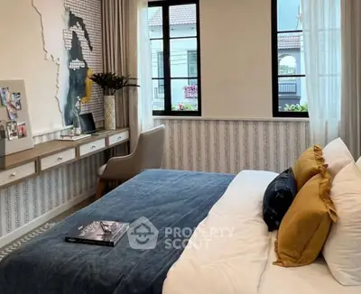 Chic bedroom with stylish decor, large windows, and cozy ambiance in modern home.