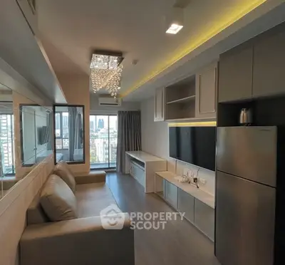 Modern living room with city view, stylish chandelier, and sleek furniture in a high-rise apartment.