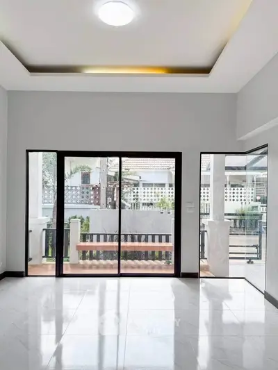 Spacious modern living room with large windows and sleek design