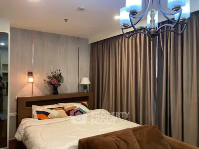 Cozy bedroom with elegant lighting and plush bedding in modern apartment