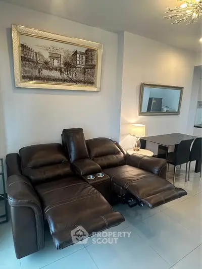 Stylish living room with leather recliner sofa and elegant dining area