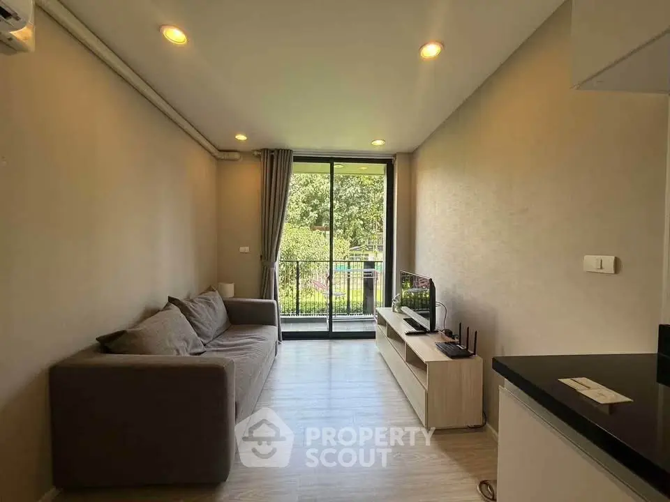 Modern living room with cozy sofa and balcony view in stylish apartment