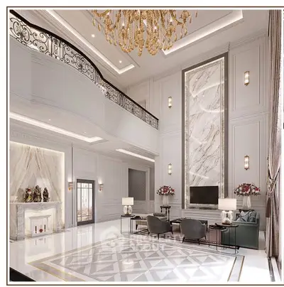 Luxurious living room with high ceilings, elegant chandelier, and marble accents.