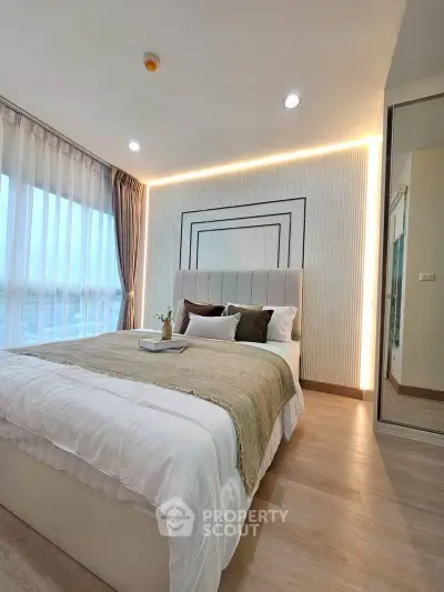 Luxurious bedroom with modern decor and large windows offering stunning views.