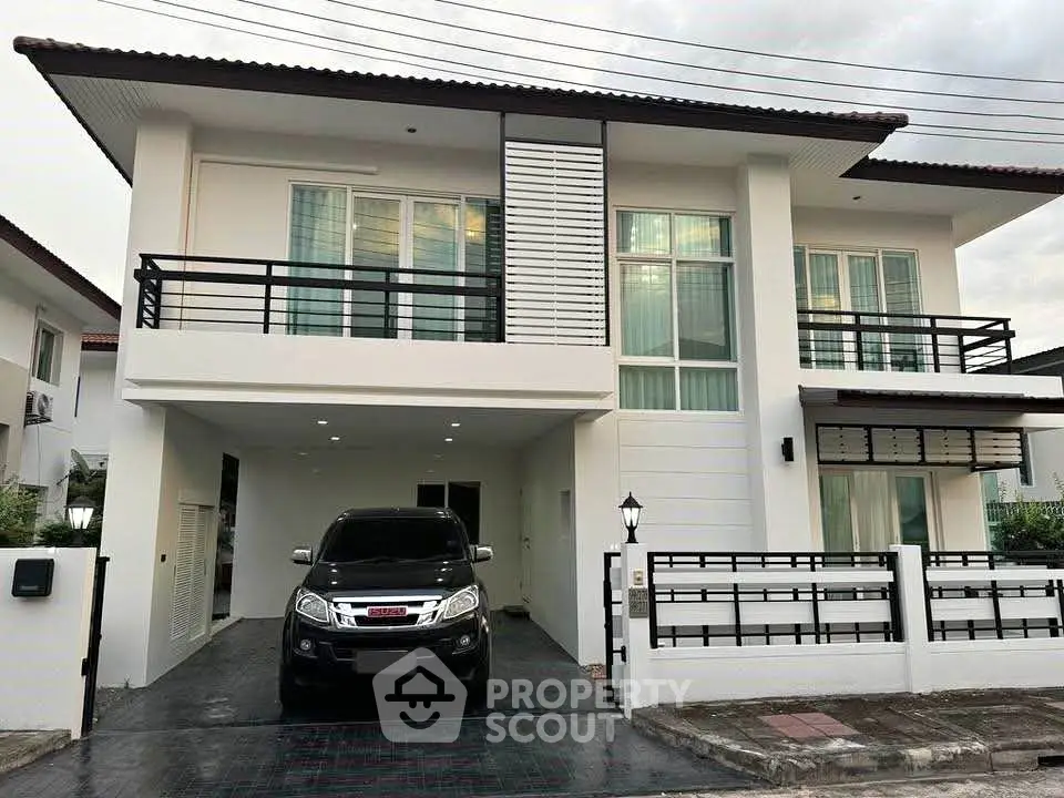 Modern two-story house with sleek design and spacious driveway