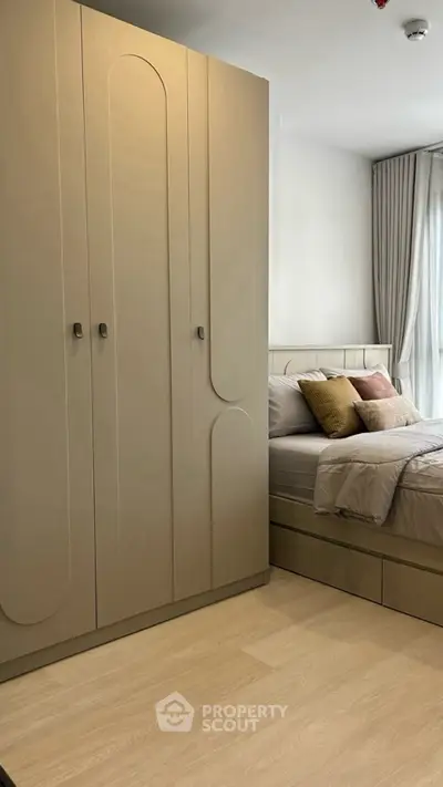 Modern bedroom with stylish wardrobe and cozy bed setup